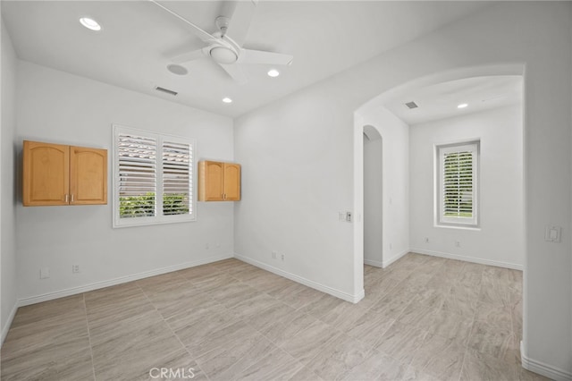 9116 Pinyon Point Ct, Corona, CA 92883 - unfurnished room featuring arched walkways, plenty of natural light, a ceiling fan, and recessed lighting