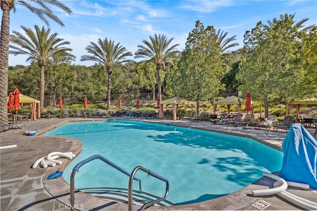 9116 Pinyon Point Ct, Corona, CA 92883 - community pool featuring a gazebo and a patio area