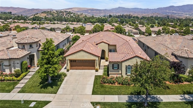 9116 Pinyon Point Ct, Corona, CA 92883 - view of front of house with a residential view, a tile roof, driveway, and a garage