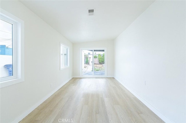 1818 W 79th St, Los Angeles, CA 90047 - spare room featuring light wood-type flooring and baseboards