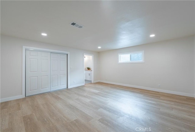 1818 W 79th St, Los Angeles, CA 90047 - unfurnished bedroom with light wood finished floors, recessed lighting, a closet, and connected bathroom