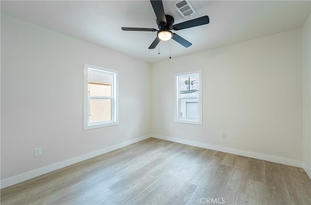 1818 W 79th St, Los Angeles, CA 90047 - unfurnished room featuring healthy amount of natural light, light wood finished floors, and ceiling fan