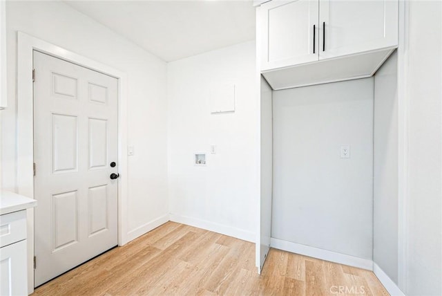 1818 W 79th St, Los Angeles, CA 90047 - laundry area featuring cabinet space, light wood-style flooring, and washer hookup