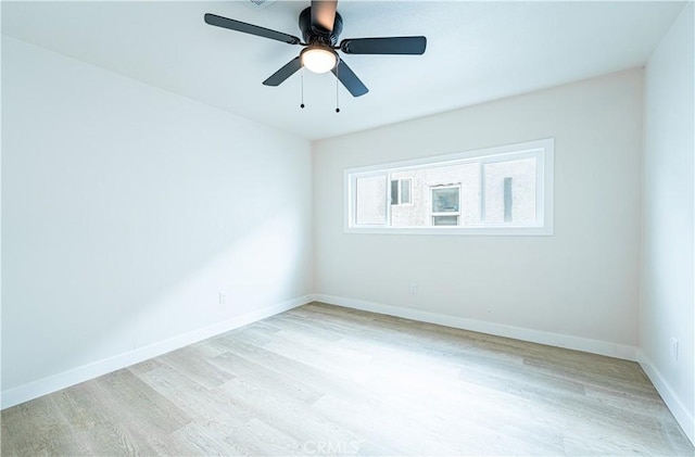 1818 W 79th St, Los Angeles, CA 90047 - empty room with light wood-style floors and a ceiling fan