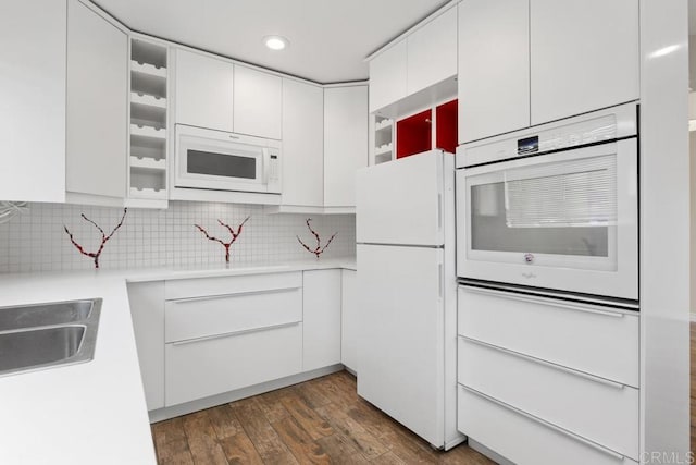 1811 E Grand Ave Unit 162, Escondido, CA 92027 - kitchen featuring white appliances, white cabinets, dark wood-style floors, light countertops, and recessed lighting