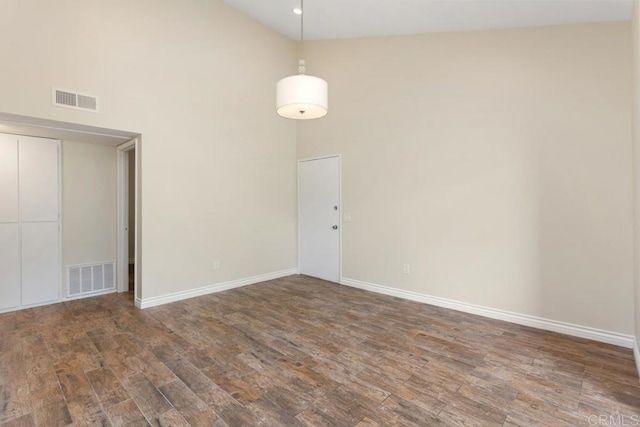 1811 E Grand Ave Unit 162, Escondido, CA 92027 - unfurnished room with high vaulted ceiling and wood finished floors