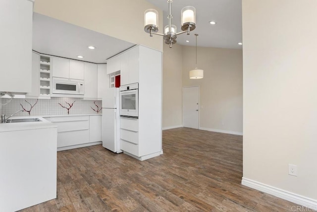 1811 E Grand Ave Unit 162, Escondido, CA 92027 - kitchen featuring white appliances, open shelves, backsplash, white cabinetry, and decorative light fixtures