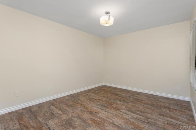 1811 E Grand Ave Unit 162, Escondido, CA 92027 - unfurnished room with wood finished floors and baseboards