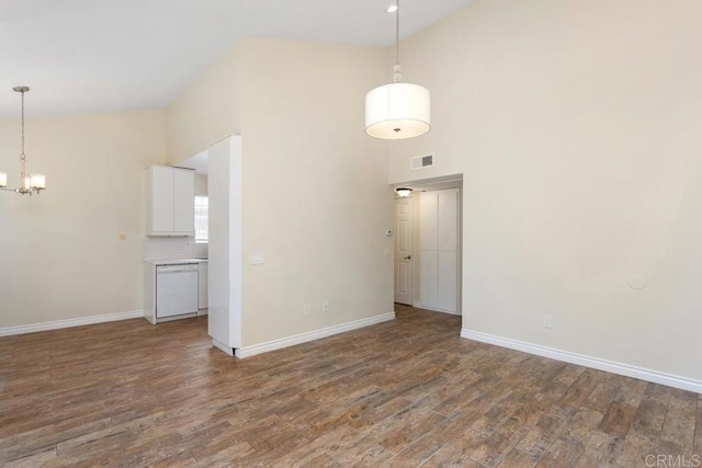 1811 E Grand Ave Unit 162, Escondido, CA 92027 - empty room with a chandelier, a towering ceiling, and wood finished floors