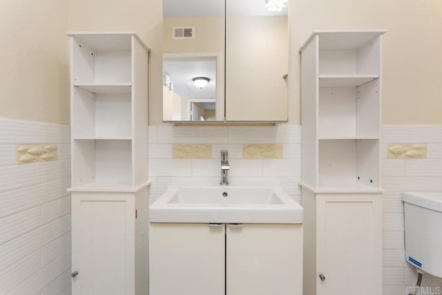 1811 E Grand Ave Unit 162, Escondido, CA 92027 - bathroom with tile walls, vanity, and wainscoting