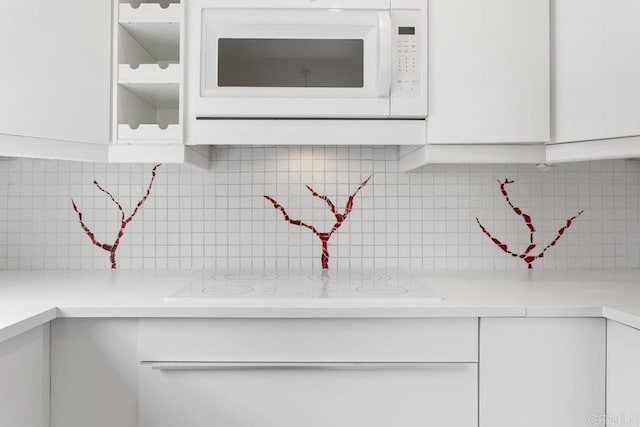 1811 E Grand Ave Unit 162, Escondido, CA 92027 - kitchen view of white appliances, white cabinets, and backsplash