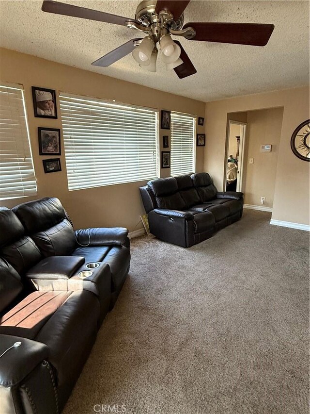 6045 Lincoln Ave, South Gate, CA 90280 - living area featuring a ceiling fan, a textured ceiling, and carpet flooring