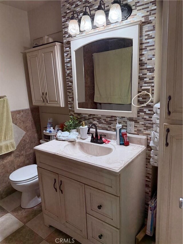 6045 Lincoln Ave, South Gate, CA 90280 - bathroom with tile walls, vanity, and wainscoting