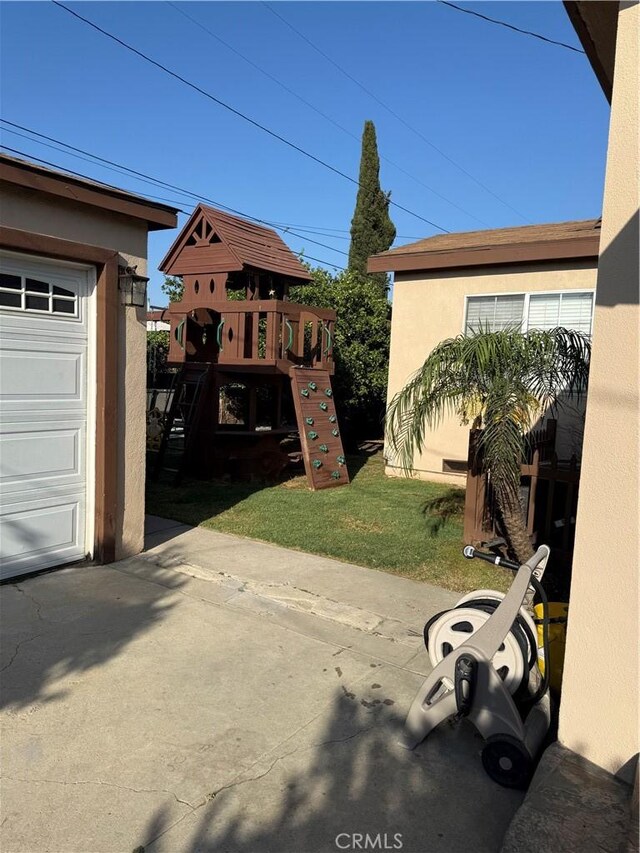 6045 Lincoln Ave, South Gate, CA 90280 - view of yard featuring a playground and a garage