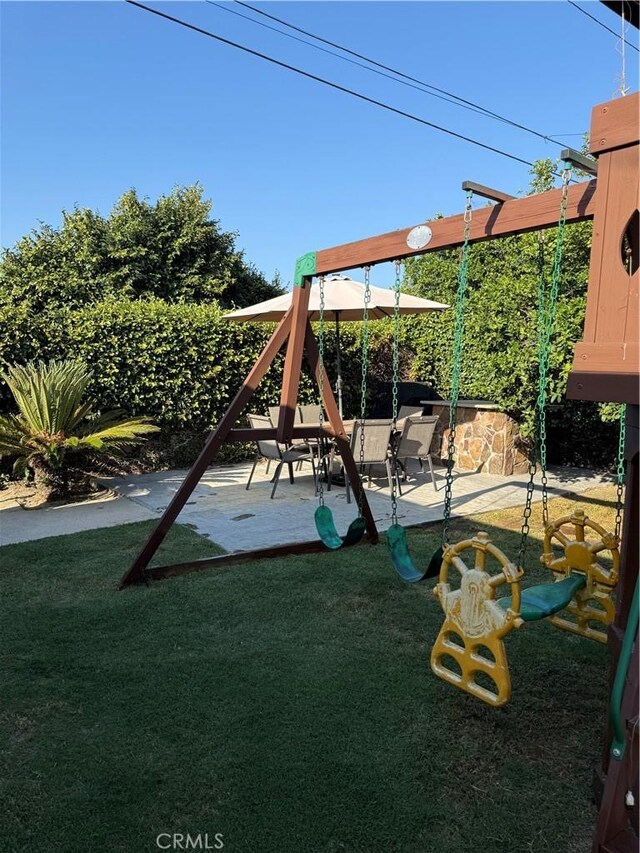 6045 Lincoln Ave, South Gate, CA 90280 - view of jungle gym with a lawn