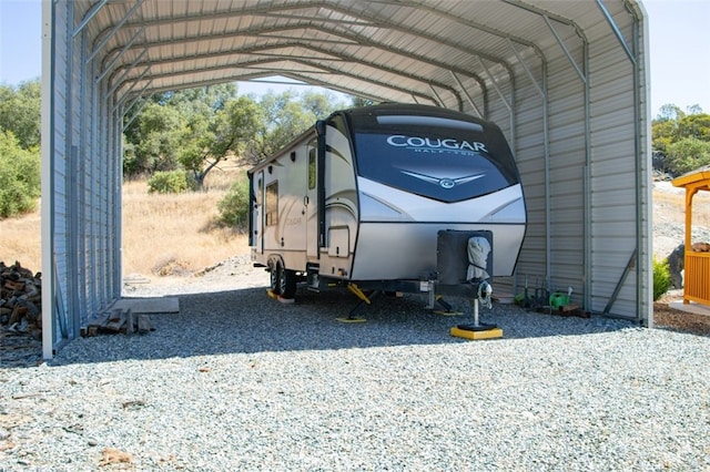 47003 Lookout Mountain Dr, Coarsegold, CA 93614 - view of parking / parking lot featuring a detached carport and gravel driveway
