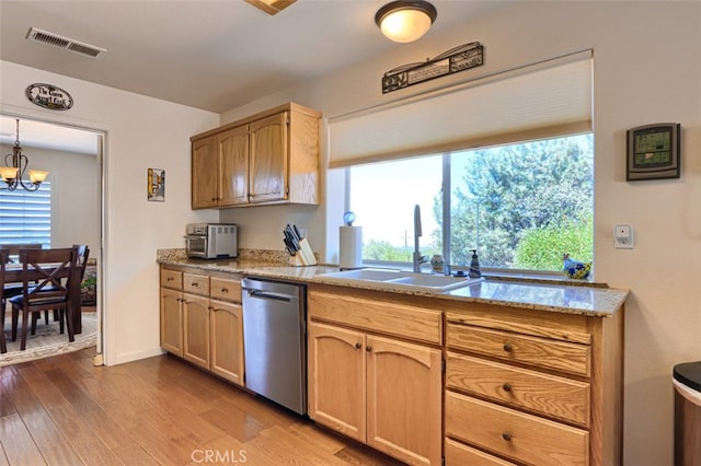 47003 Lookout Mountain Dr, Coarsegold, CA 93614 - kitchen with stainless steel dishwasher, light wood-style floors, a chandelier, and light stone counters