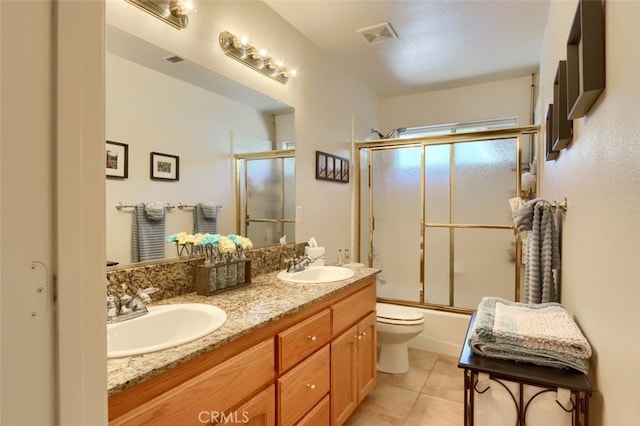47003 Lookout Mountain Dr, Coarsegold, CA 93614 - full bath featuring double vanity, enclosed tub / shower combo, and tile patterned floors