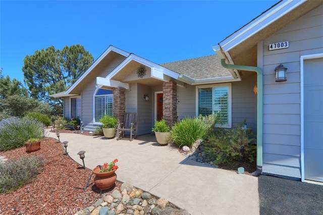 47003 Lookout Mountain Dr, Coarsegold, CA 93614 - view of exterior entry featuring roof with shingles