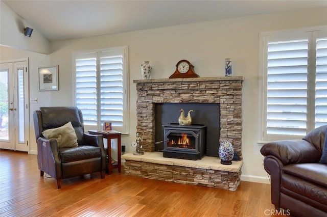 47003 Lookout Mountain Dr, Coarsegold, CA 93614 - sitting room featuring wood finished floors, vaulted ceiling, and a fireplace