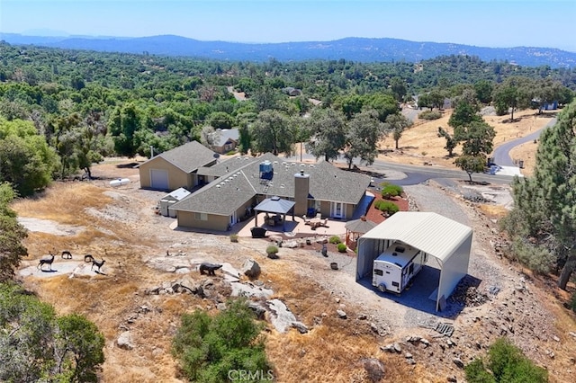 47003 Lookout Mountain Dr, Coarsegold, CA 93614 - view of subject property with a mountain backdrop and a heavily wooded area