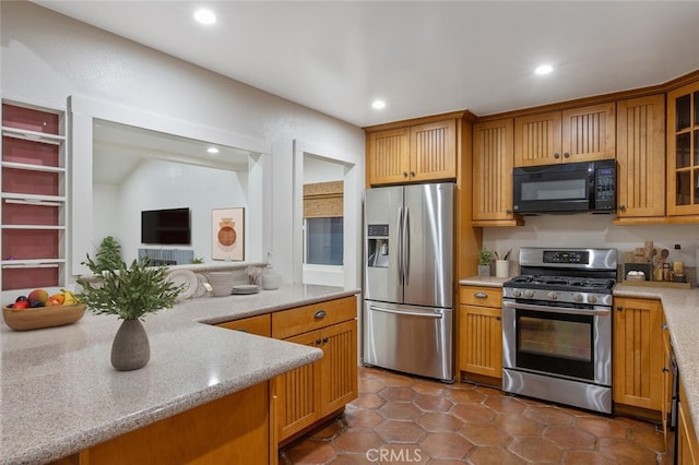 27403 Garza Dr, Saugus, CA 91350 - kitchen featuring stainless steel appliances, recessed lighting, glass insert cabinets, dark tile patterned flooring, and light stone counters