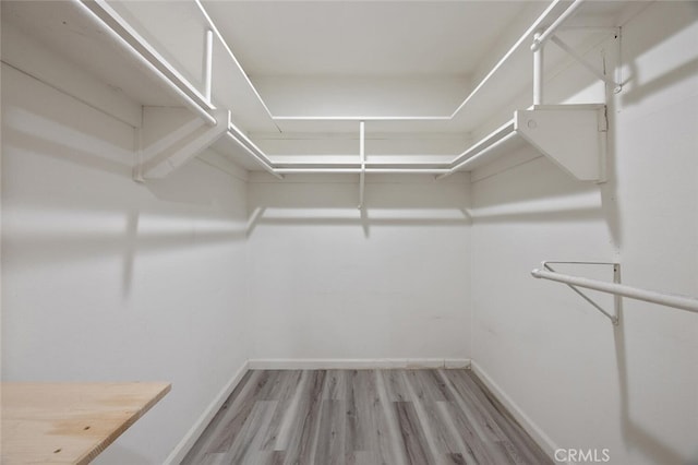 27403 Garza Dr, Saugus, CA 91350 - spacious closet featuring wood finished floors