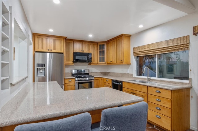 27403 Garza Dr, Saugus, CA 91350 - kitchen featuring black appliances, recessed lighting, glass insert cabinets, light stone counters, and a breakfast bar area