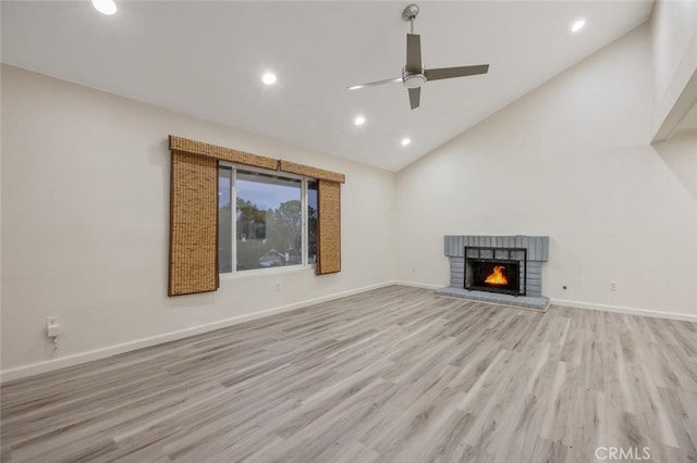 27403 Garza Dr, Saugus, CA 91350 - unfurnished living room with ceiling fan, light wood finished floors, recessed lighting, a fireplace, and high vaulted ceiling