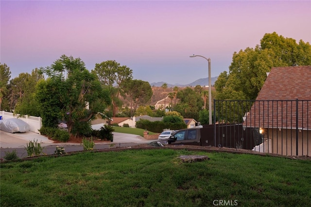 27403 Garza Dr, Saugus, CA 91350 - yard at dusk featuring a lawn and a mountain view