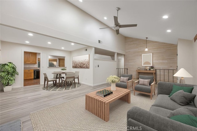 27403 Garza Dr, Saugus, CA 91350 - living area featuring wooden walls, light wood-style floors, recessed lighting, a ceiling fan, and high vaulted ceiling