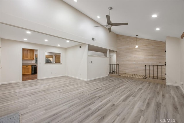 27403 Garza Dr, Saugus, CA 91350 - unfurnished living room with wooden walls, recessed lighting, high vaulted ceiling, light wood-style floors, and ceiling fan