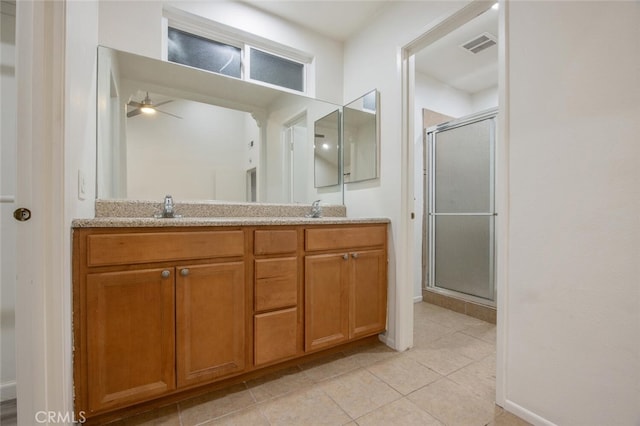 27403 Garza Dr, Saugus, CA 91350 - full bath featuring double vanity, a ceiling fan, a stall shower, and tile patterned floors