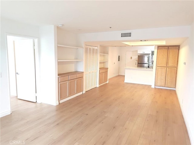 321 N Orange Ave Unit 103, Monterey Park, CA 91755 - unfurnished living room with light wood-type flooring