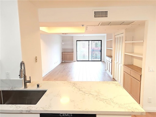 321 N Orange Ave Unit 103, Monterey Park, CA 91755 - unfurnished living room featuring a sink and light wood-style floors