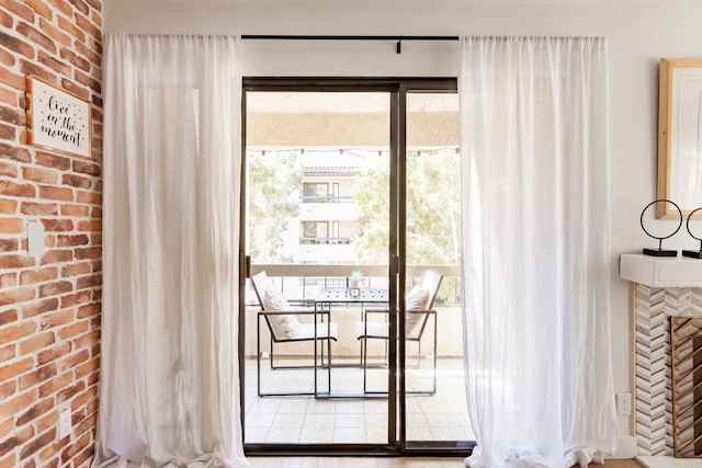 5645 Friars Rd Unit 370, San Diego, CA 92110 - doorway to outside featuring brick wall and a fireplace