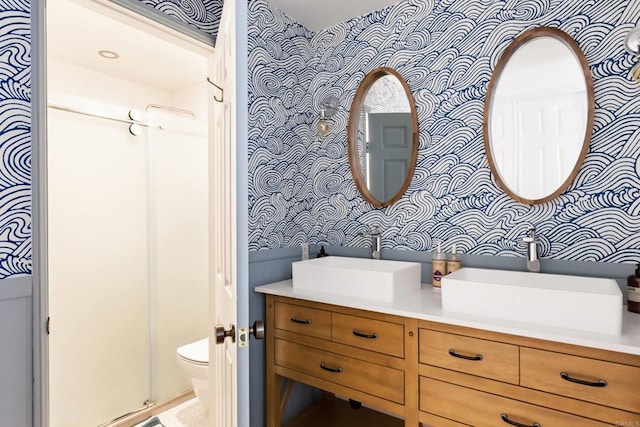 5645 Friars Rd Unit 370, San Diego, CA 92110 - bathroom featuring wallpapered walls, double vanity, and a stall shower