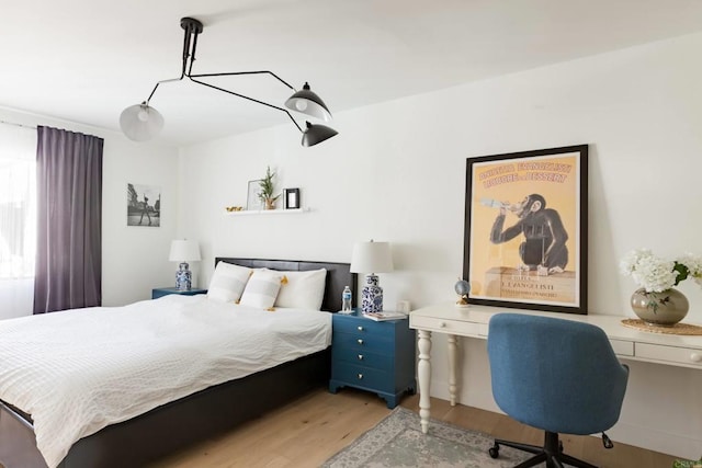 5645 Friars Rd Unit 370, San Diego, CA 92110 - bedroom with light wood-type flooring and a desk