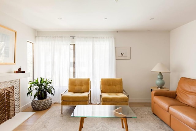 5645 Friars Rd Unit 370, San Diego, CA 92110 - living room with wood finished floors and a tiled fireplace