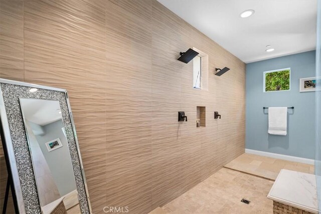 17 Emerald Ct, Rancho Mirage, CA 92270 - full bathroom with a tile shower, tile walls, recessed lighting, and tile patterned flooring