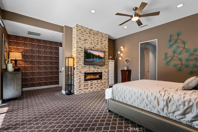 17 Emerald Ct, Rancho Mirage, CA 92270 - bedroom featuring dark carpet, a fireplace, recessed lighting, and an accent wall