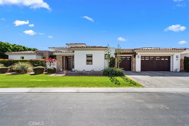 17 Emerald Ct, Rancho Mirage, CA 92270 - mediterranean / spanish-style house with stucco siding, a garage, driveway, and a tile roof