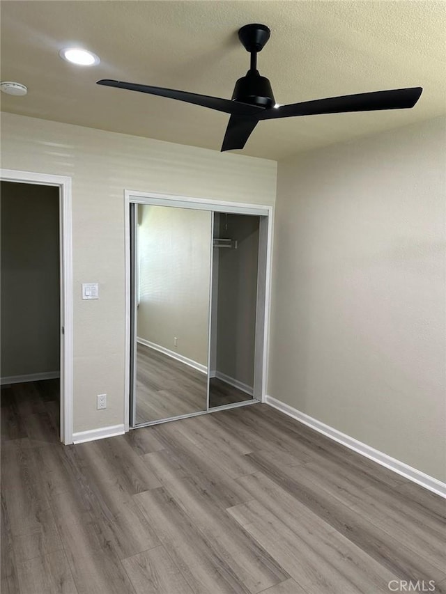 15702 Halldale Ave, Gardena, CA 90247 - unfurnished bedroom featuring wood finished floors, a closet, ceiling fan, and recessed lighting