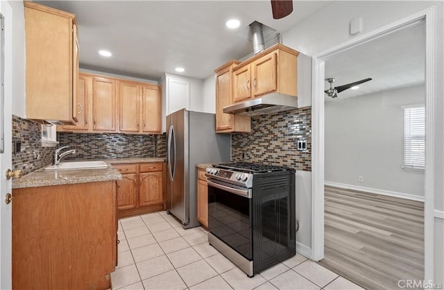 15702 Halldale Ave, Gardena, CA 90247 - kitchen featuring stainless steel gas stove, under cabinet range hood, backsplash, light tile patterned floors, and light brown cabinets