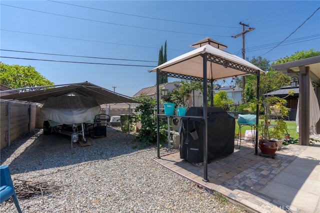 2247 Stratford Way, La Verne, CA 91750 - view of patio with grilling area, a carport, and driveway