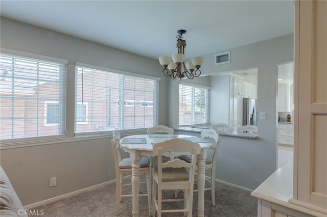 2247 Stratford Way, La Verne, CA 91750 - dining area with a chandelier and light colored carpet