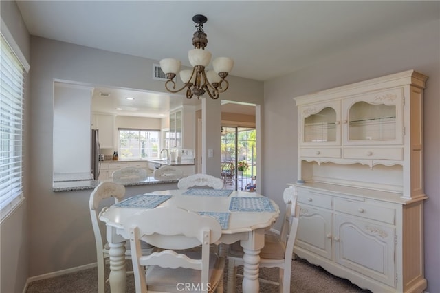 2247 Stratford Way, La Verne, CA 91750 - dining space featuring a chandelier and carpet