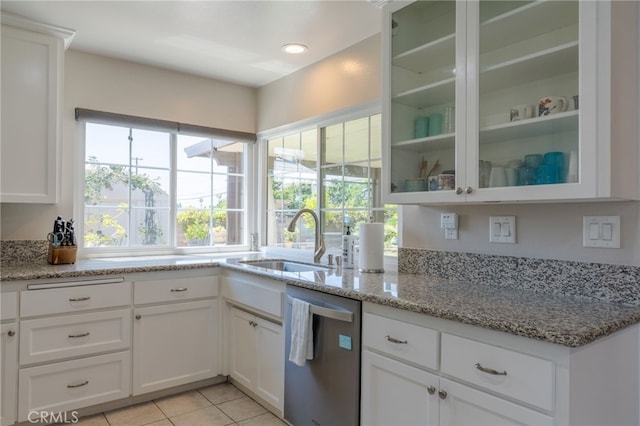 2247 Stratford Way, La Verne, CA 91750 - kitchen with dishwasher, white cabinetry, glass insert cabinets, light tile patterned floors, and light stone countertops