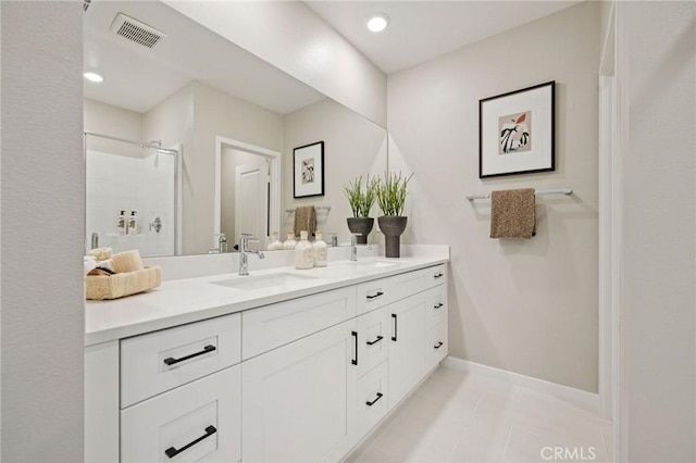 15218 Janine Dr Unit 2, Whittier, CA 90605 - full bathroom with double vanity, a shower with door, and tile patterned flooring