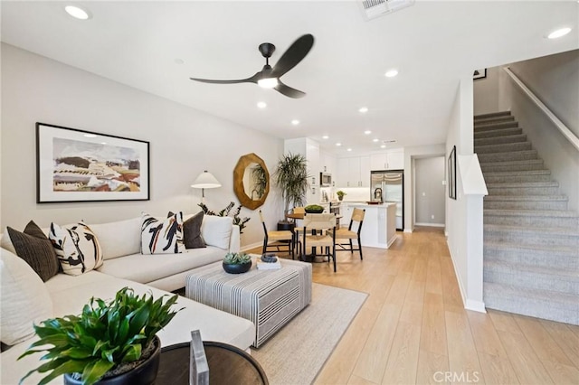 15218 Janine Dr Unit 2, Whittier, CA 90605 - living room featuring ceiling fan, recessed lighting, stairs, and light wood-style floors